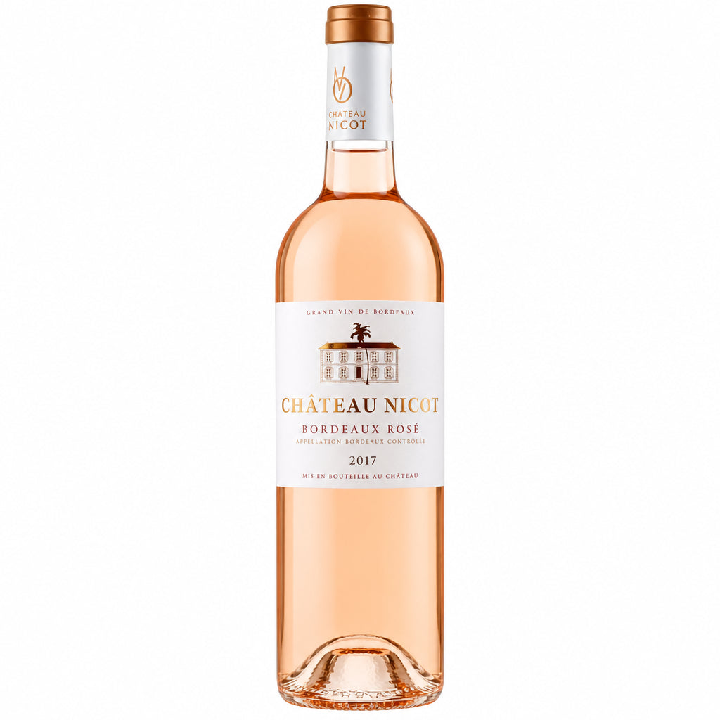 Chateau Nicot Rose wine bottle with a pink label, standing on a wooden surface against a blurred background.