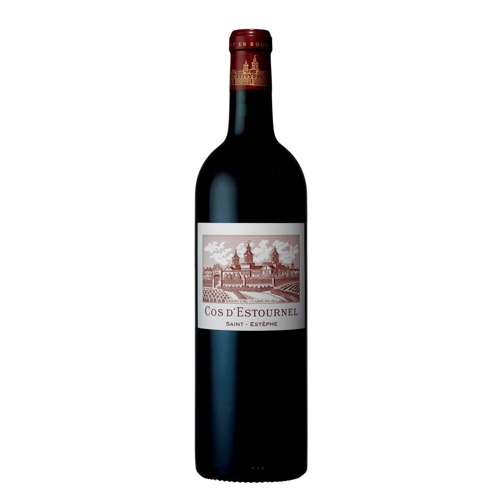 Chateau Cos D'estournel 2021 wine bottle with label and glass of red wine on a wooden table.