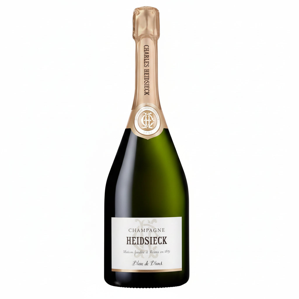 Bottle of Charles Heidsieck Blanc De Blancs Champagne with white label and elegant glassware in the background.