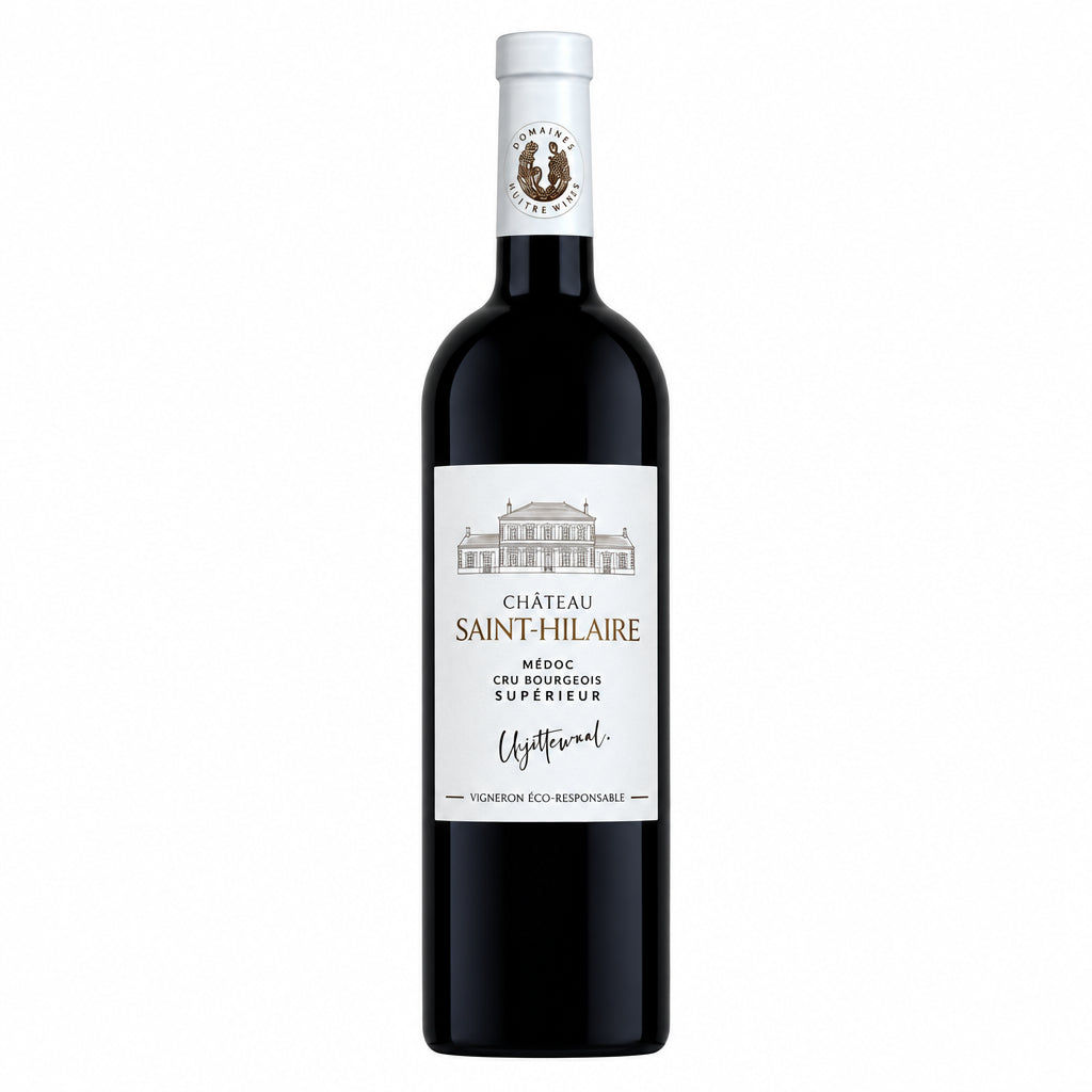 Bottle of Chateau Saint Hilaire Medoc 2020 red wine with label visible, standing on a wooden surface against a blurred background.