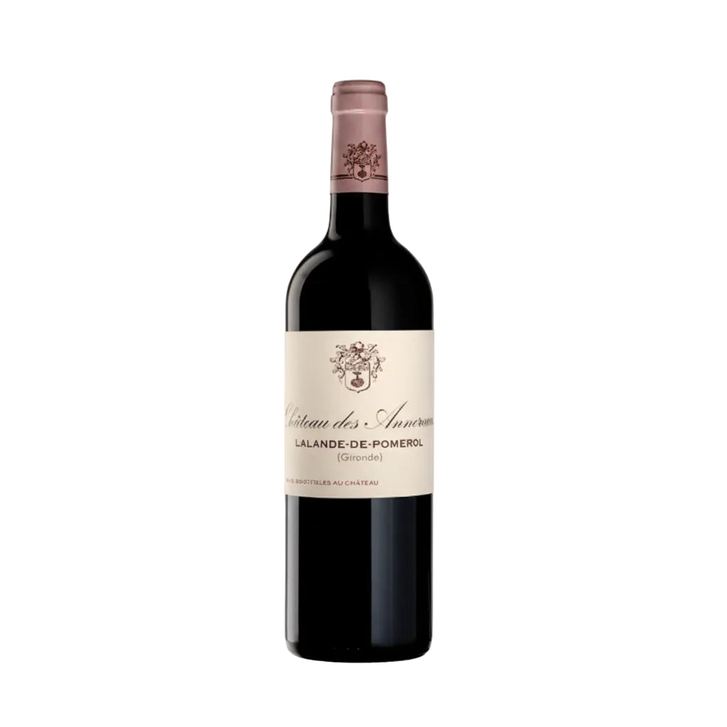 Chateau Des Annereaux Les Annereaux red wine bottle with label, standing upright on a wooden table.
