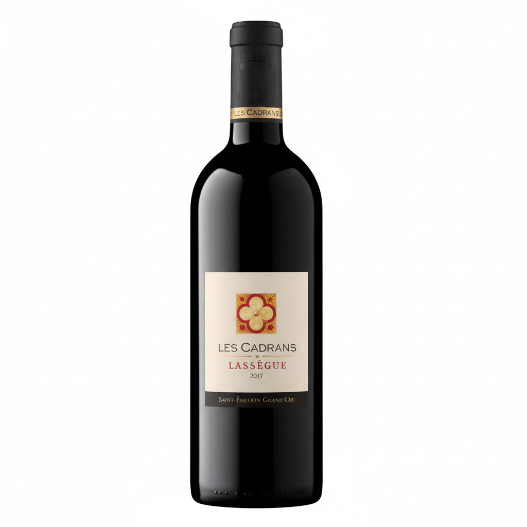 Bottle of Chateau Lassegue Les Cadrans de Lassegue Grand Cru red wine in a wine glass, showcasing the elegant label and deep red color.
