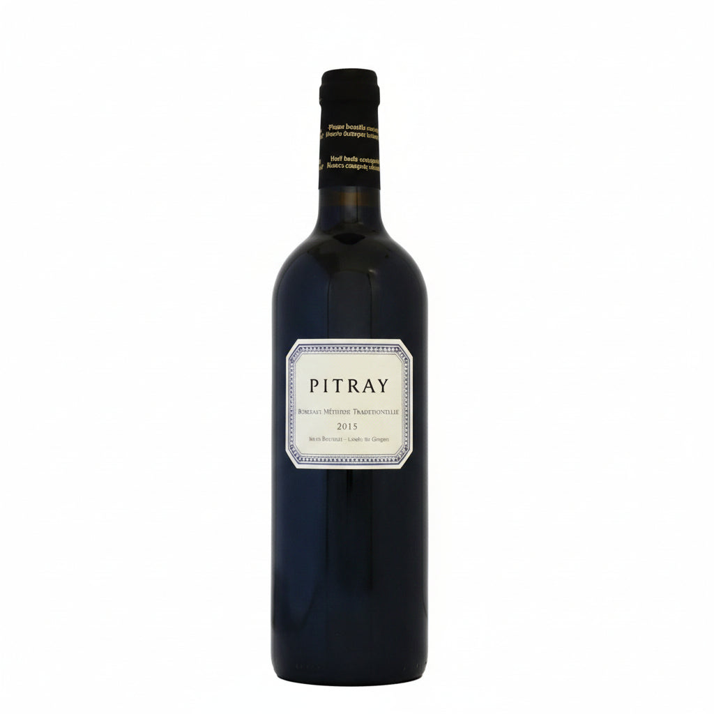 Chateau Pitray Mitjaville Cotes de Castillon red wine bottle with label showing, on a wooden surface.