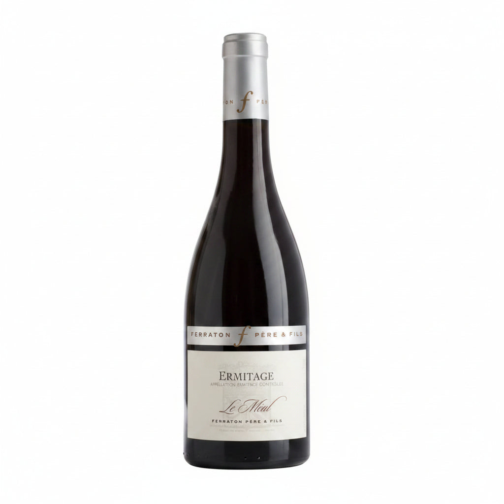 Bottle of Ferraton Ermitage Le Meal Rouge red wine with a dark label and elegant bottle shape.