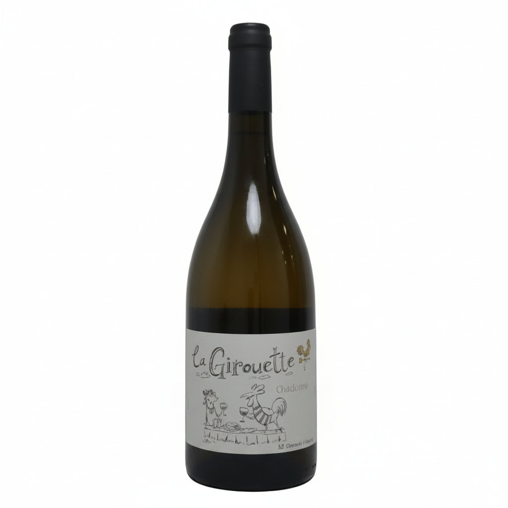 Glass of La Girouette Chardonnay wine in a clear wine glass, showcasing its golden color and clarity.
