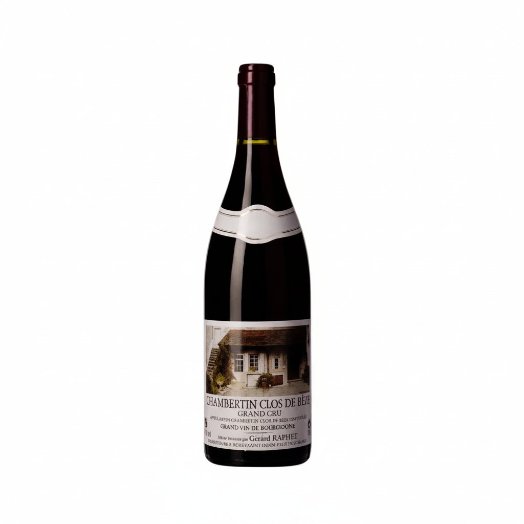 Bottle of Raphet Chambertin Clos De Beze Grand Cru wine with label visible on a wooden surface.