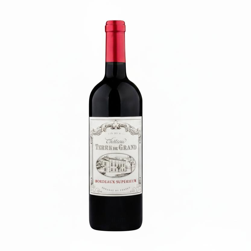 Bottle of Chateau Terre De Grand Bordeaux Superieur red wine with a dark label and elegant shape.