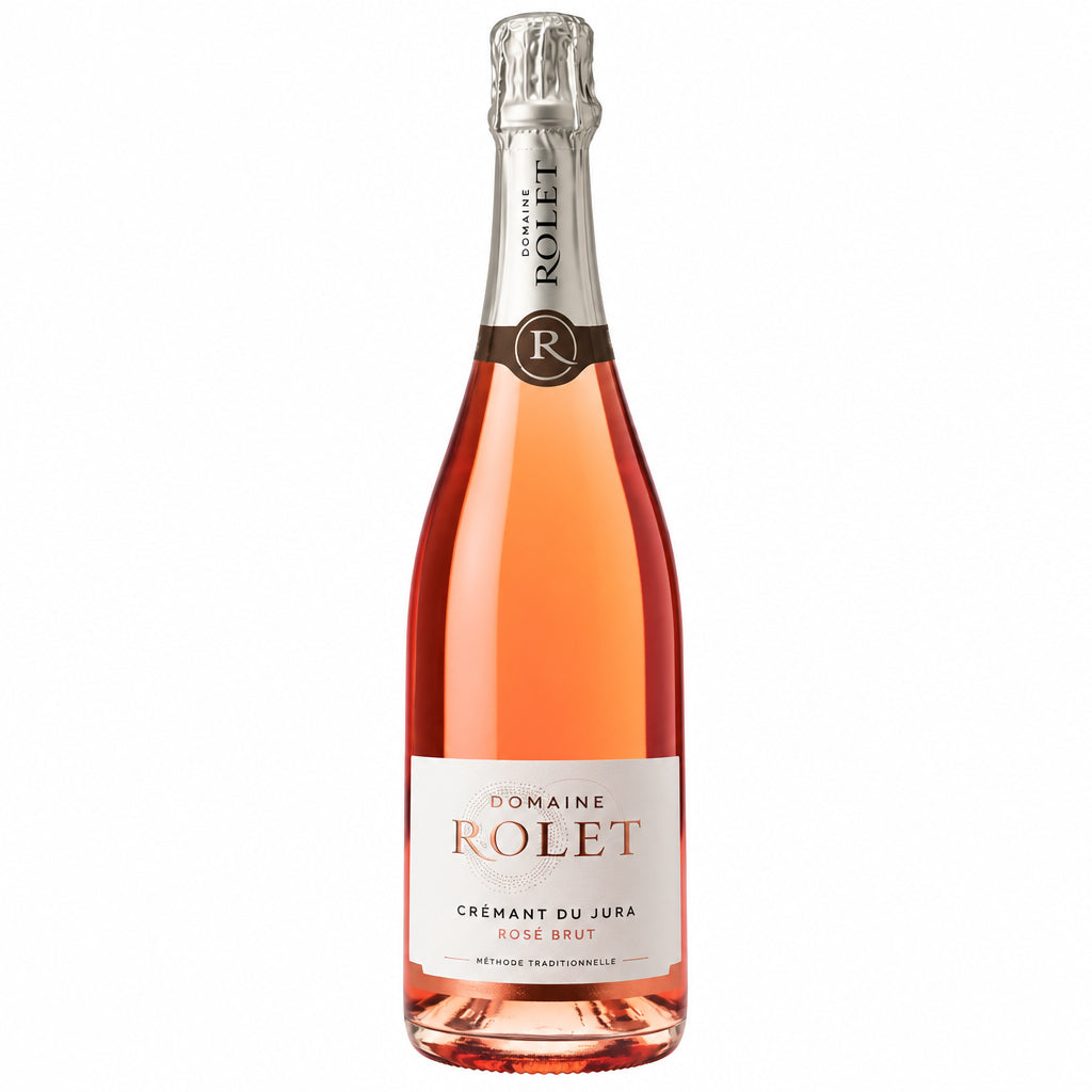Domaine Rolet Cremant du Jura Rosé sparkling wine bottle with pink label and foil, showcasing elegant French wine packaging.
