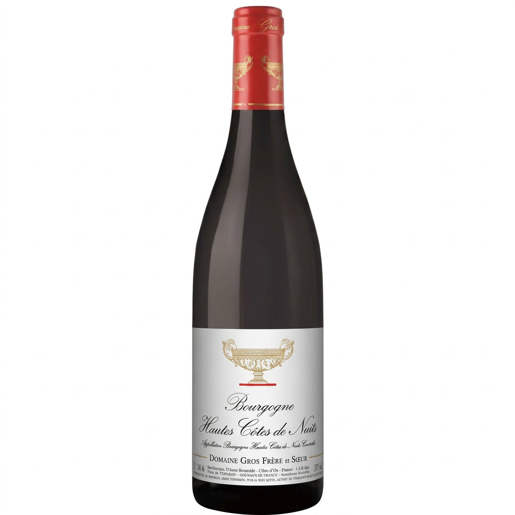 Domaine Gros Frere et Soeur Bourgogne Haute Cote Nuits Rouge wine bottle with label, glass of red wine and vineyard background