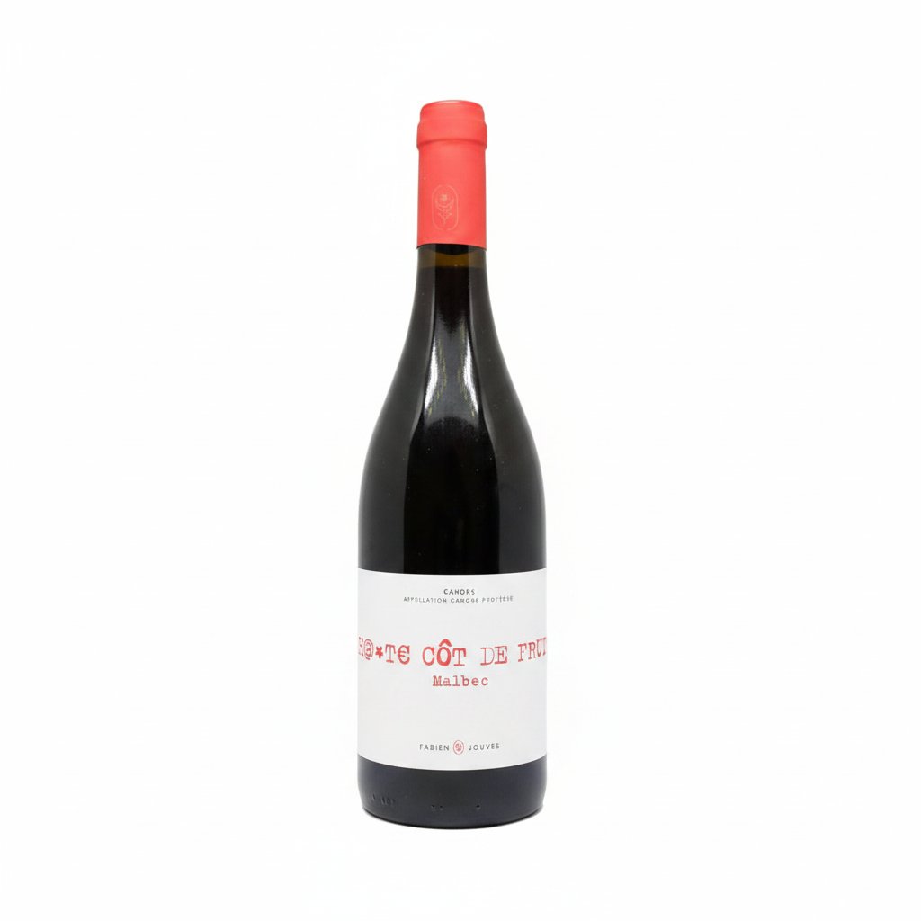 Bottle of Cahors Mas Del Perie Cote De Fruit red wine with dark red liquid and label visible in a glass.