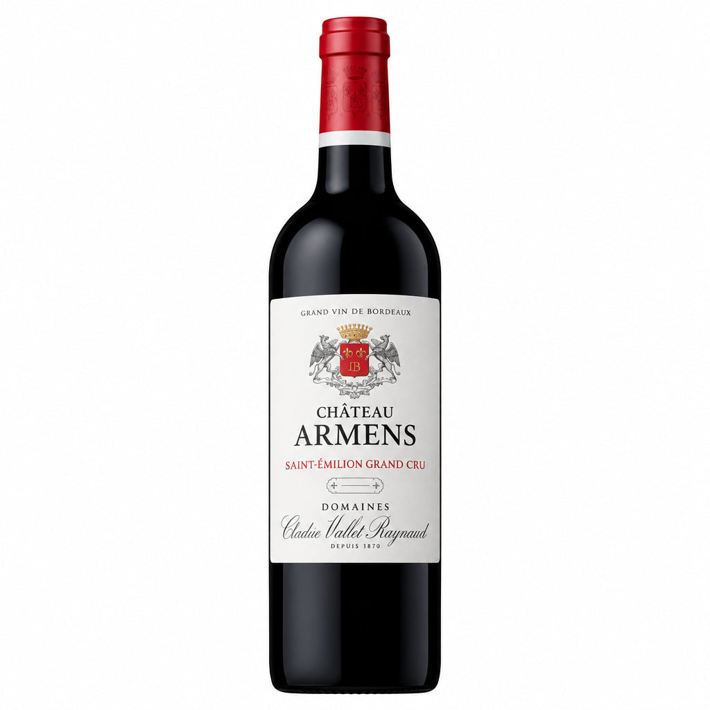Chateau Armens wine bottle with label showing elegant design, placed on a wooden surface with a blurred background.
