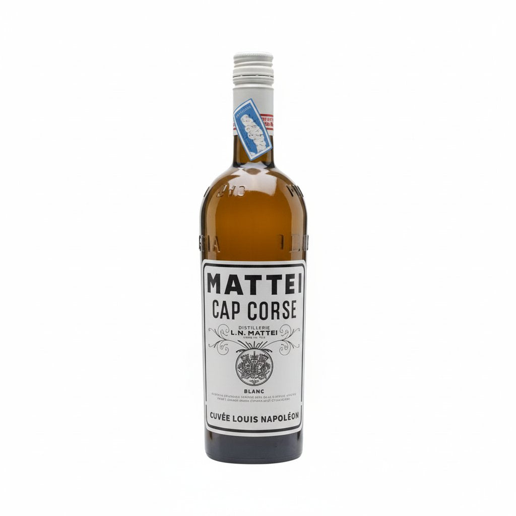 Mattei Blanc Cuvee Louis Napoleon wine bottle with elegant label, standing upright on a wooden surface.