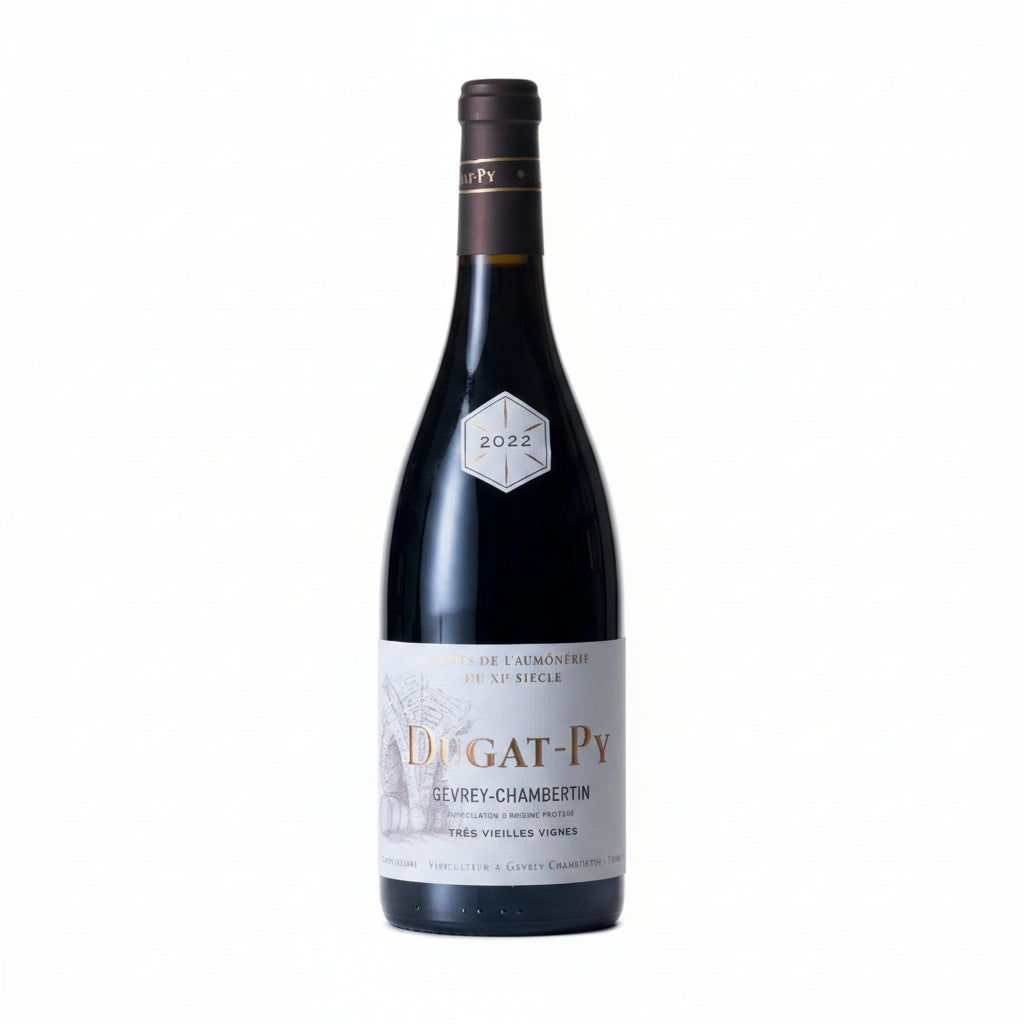 Bottle of Domaine Dugat-Py Gevrey Chambertin Coeur De Roy red wine in a glass, showcasing deep ruby color and elegant label.