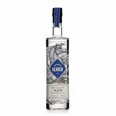 Seventh Heaven Dry Gin 750mL bottle with clear glass and label featuring blue and white design, on a wooden surface.