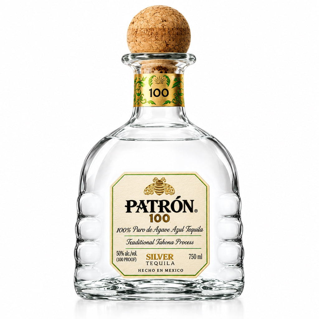 A bottle of Patrón 100 Silver Tequila de Agave on a solid white background. The clear glass bottle features a textured design, a cork stopper, and a cream-colored label with gold details.