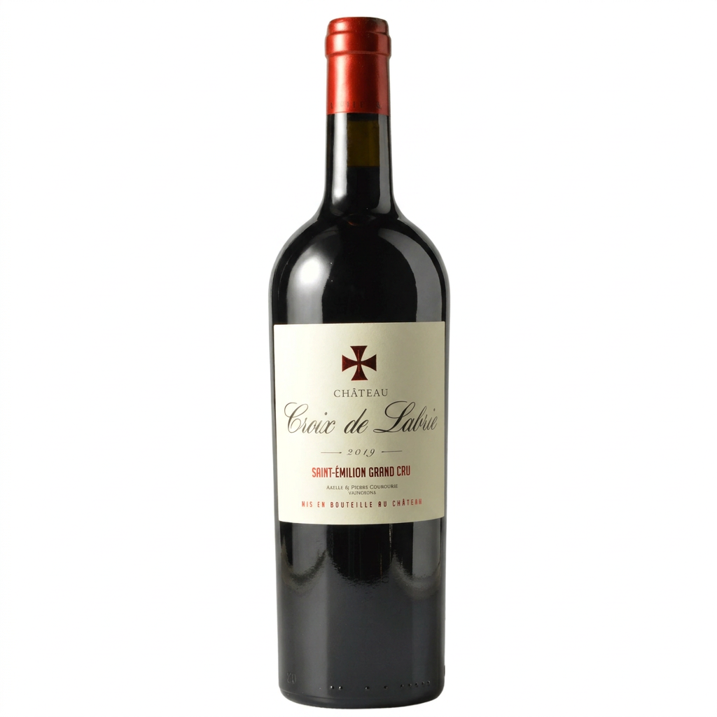 Chateau Croix De Labrie wine bottle with label featuring elegant design and vineyard imagery, standing upright on a wooden surface.