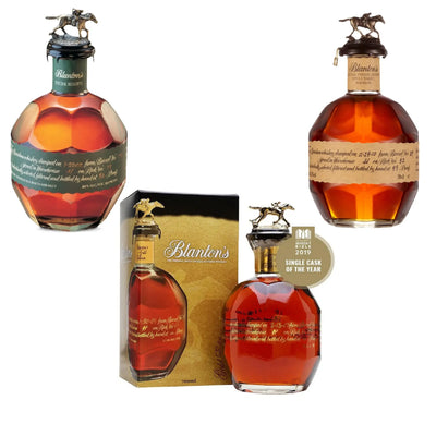 Three bottles of Blanton’s Bourbon in 750mL bottles, arranged together in a display, showcasing the Blanton’s bourbon trio bundle.