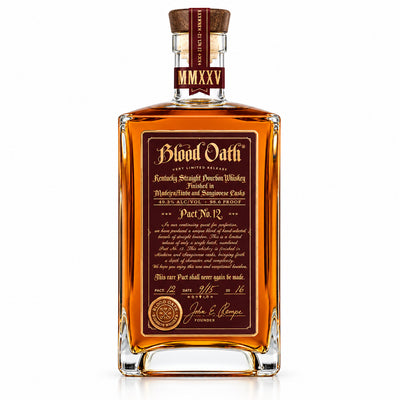 Blood Oath Pact No. 12 bourbon bottle, 750mL, with distinctive label and dark glass, on a wooden surface.