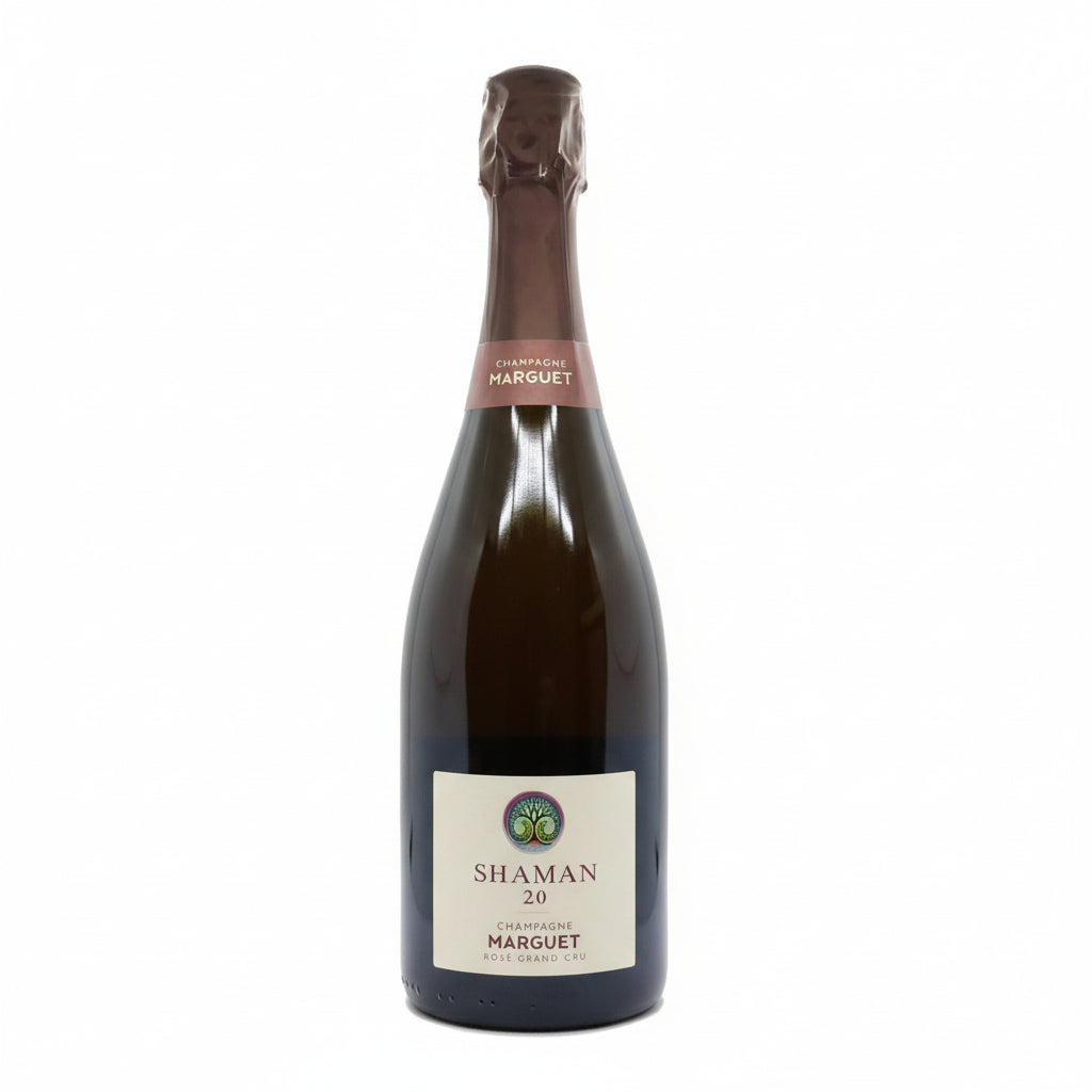 Champagne Marguet Shaman Grand Cru Rose in a flute glass with a pink hue and elegant bubbles.