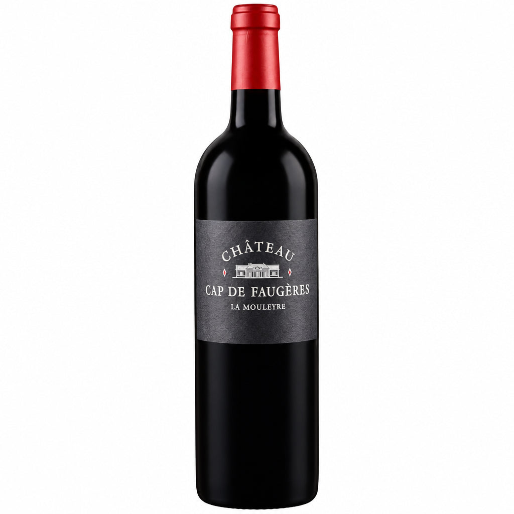 Bottle of Chateau Cap De Faugeres La Mouleyre 2016 red wine in a glass with a blurred vineyard background.