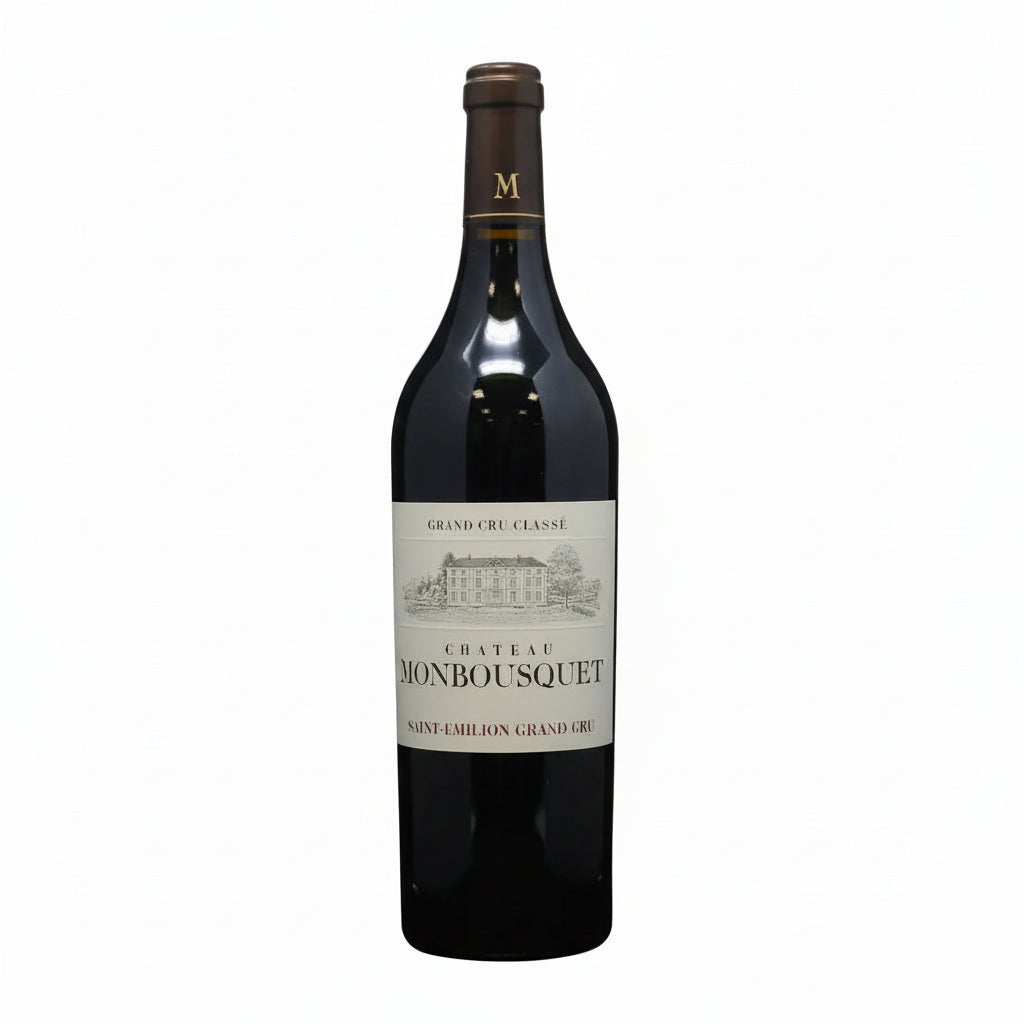 Bottle of Chateau Monbousquet 2016 red wine with label visible in a clear glass bottle.