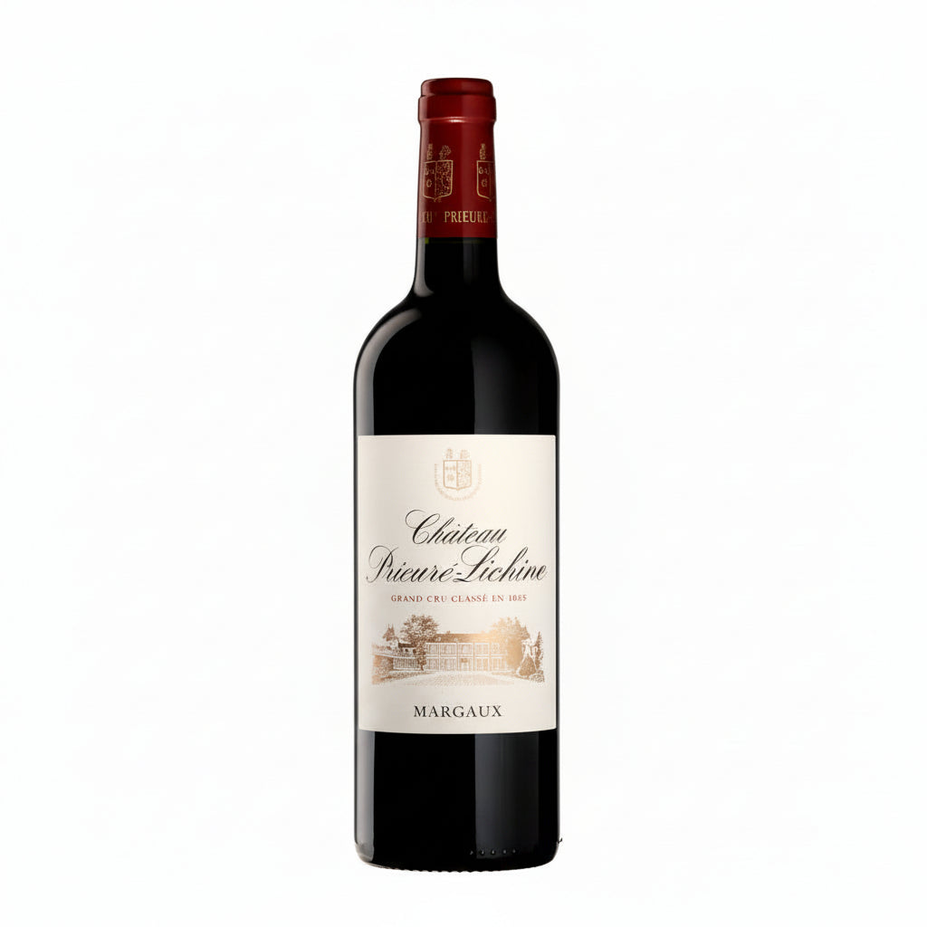 Bottle of Chateau Prieure Lichine 2016 red wine with label visible, placed on a wooden surface with wine glasses in the background.