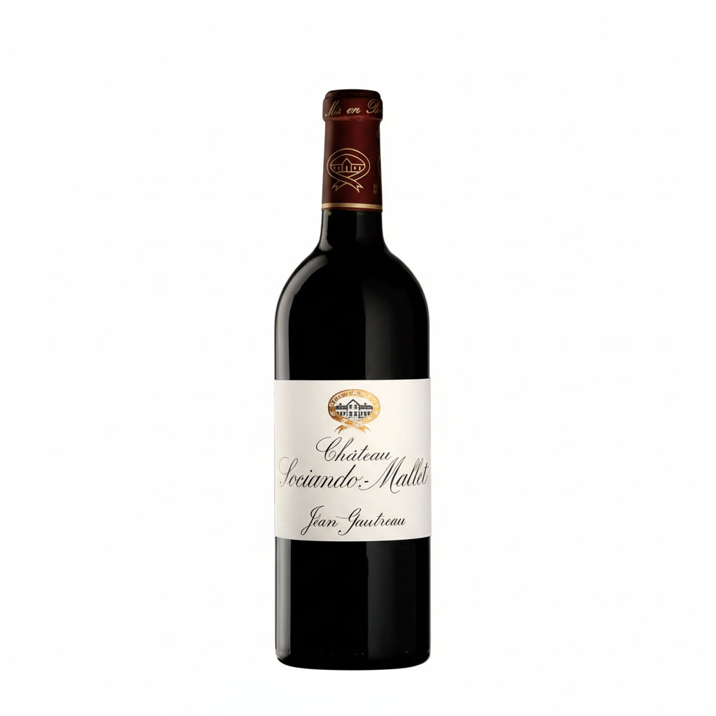 Bottle of Chateau Sociando Mallet 2016 red wine with a classic label and deep red color in a wine glass.