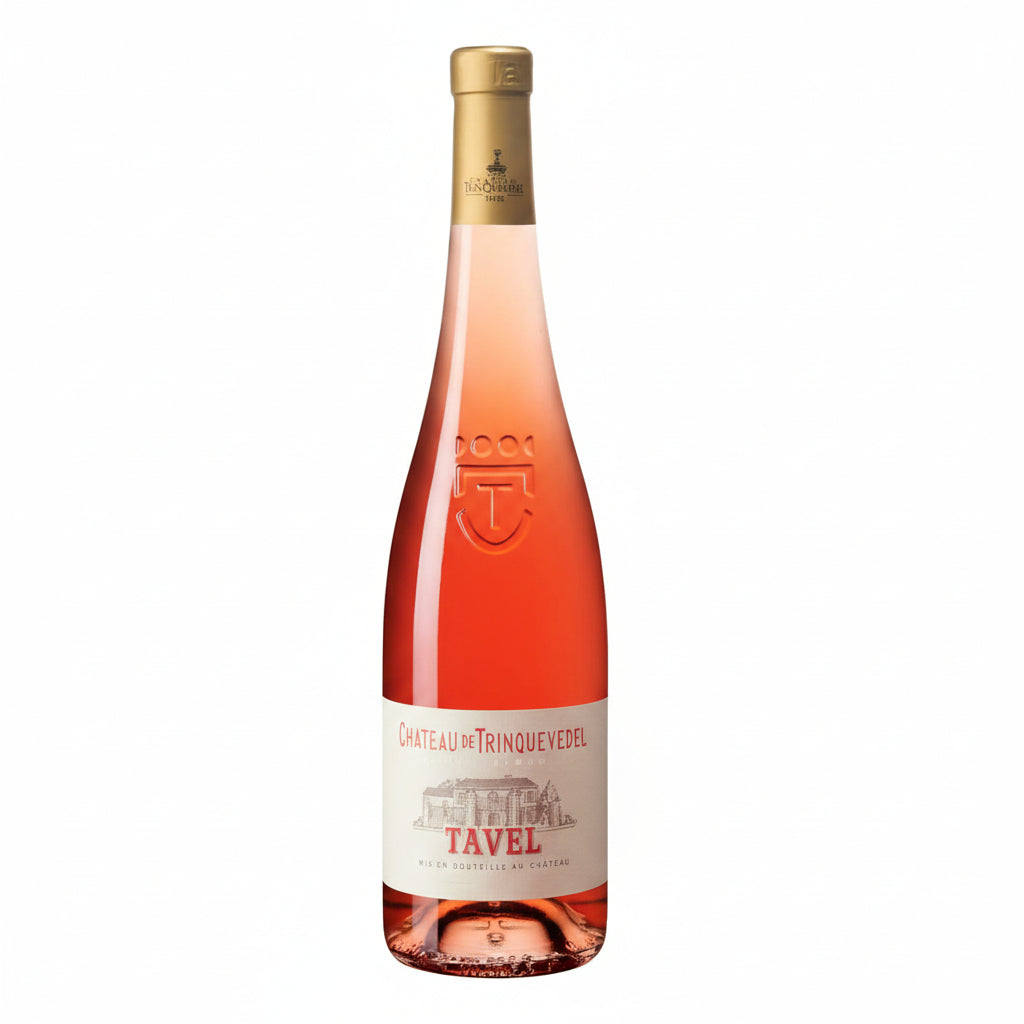 Chateau Trinquevedel Tavel Rose wine bottle with label and glass of rosé wine on a wooden table.