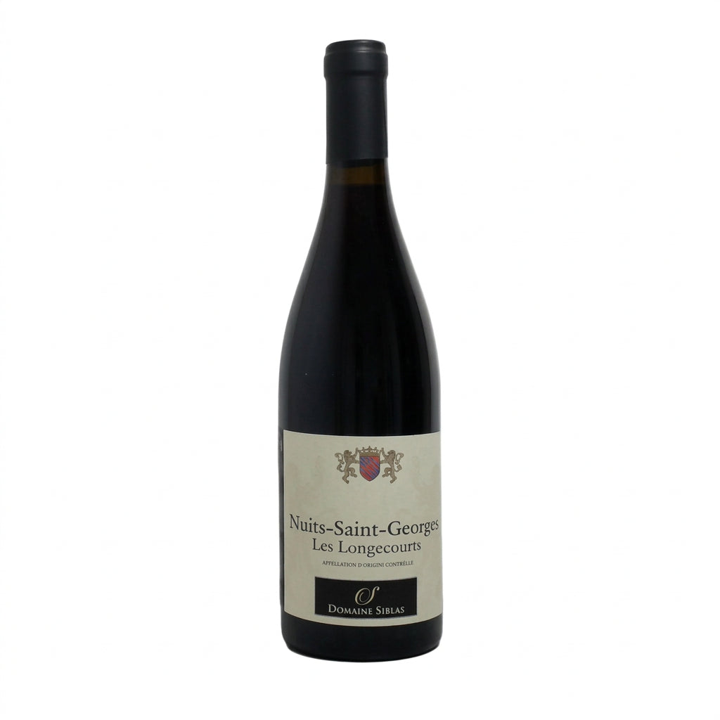 Bottle of Domaine Siblas Nuits Saint Georges Les Longecourts red wine with vineyard scenery in the background.