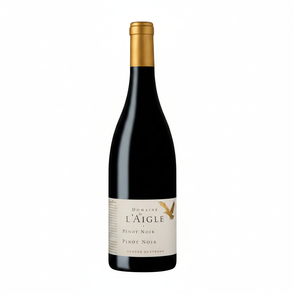 Gerard Bertrand Domaine L'aigle Pinot Noir wine bottle with label and elegant glass of red wine.