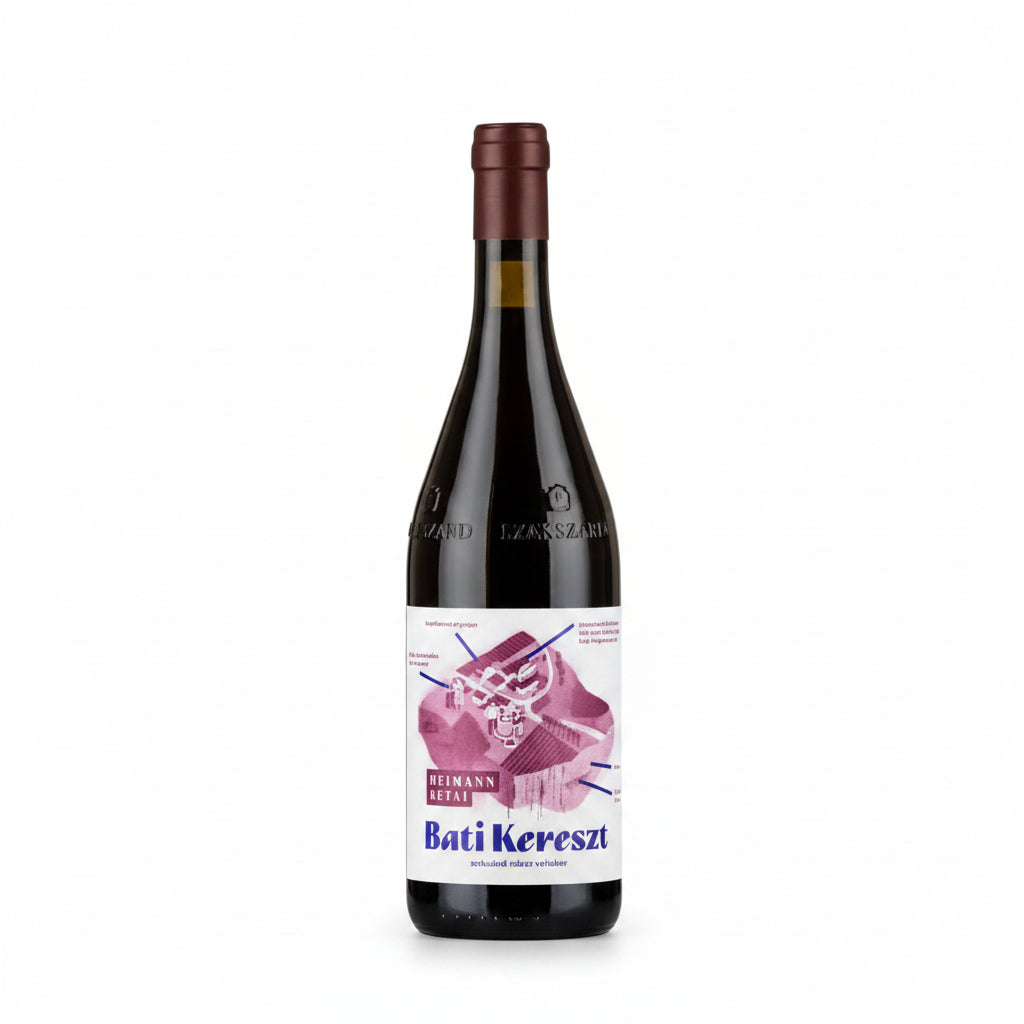 Heimann Bati Kereszt Kekfrankos red wine in 750mL bottle, featuring a dark glass bottle with a colorful label, on a wooden surface.