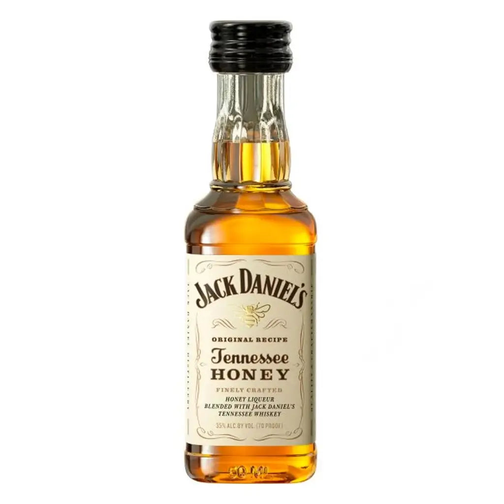 Buy Jack Daniel's Tennessee Honey liqueur mini bottle with golden label, isolated on white
