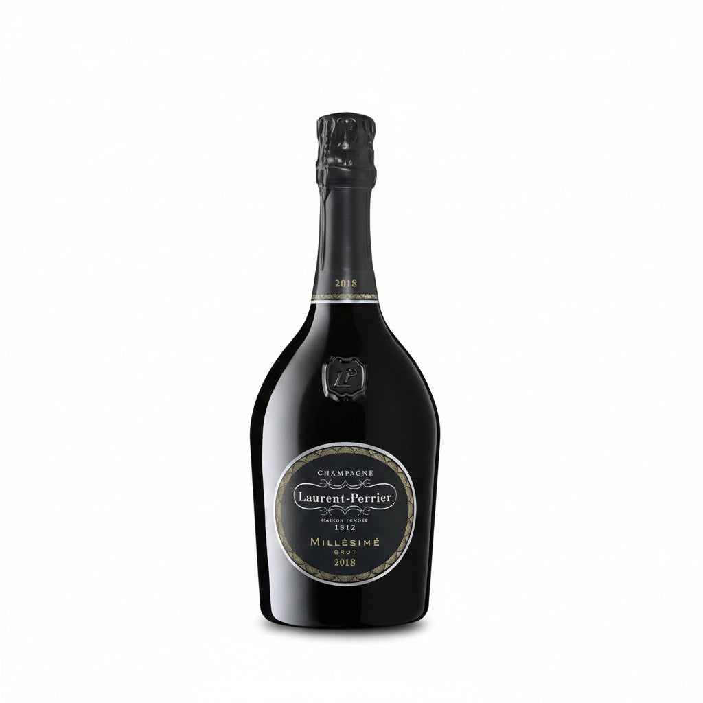 A bottle of Laurent Perrier Brut Millesime champagne with a gold foil label and elegant glass flute beside it.