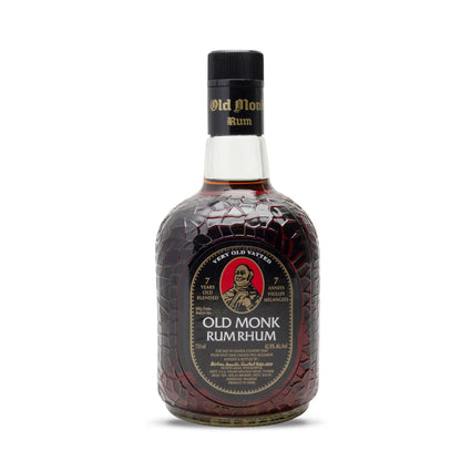 Buy Old Monk 7 Years Rum 750mL, dark rum bottle with embossed texture and label