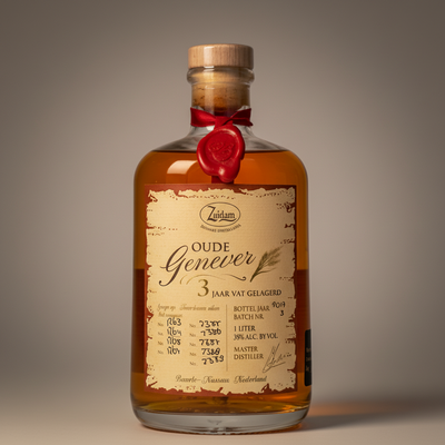 Bottle of Old Oude Genever 3 Year Old in a clear 1L glass bottle with a label featuring vintage-style design.