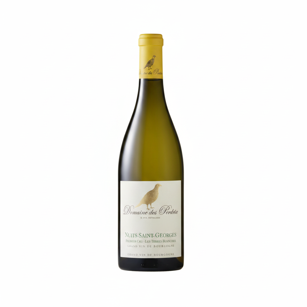 Bottle of Perdrix Nuits St Georges 1Er Cru red wine showing the label and glass with wine in a refined setting.