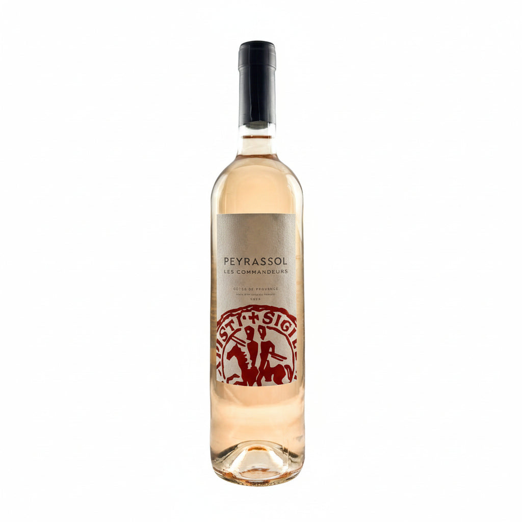 Chateau Peyrassol Cotes de Provence Rose wine bottle with label featuring Cuvée des Commandeurs design and vibrant pink color.