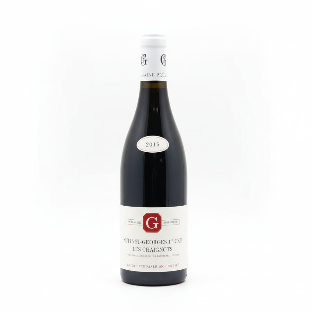 Bottle of Phillipe Gavignet Nuits-Saint-Georges 1er Aux Thorey red wine in a wine glass and on a wooden table.