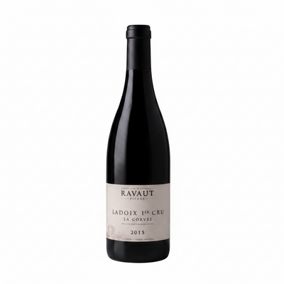 Bottle of Pierre Ravaut Ladoix 1er Cru La Corvee 2020 red wine in a glass with a vineyard background