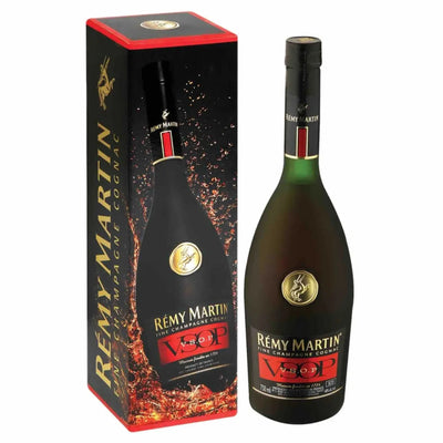Remy Martin VSOP Fine Champagne Cognac bottle with label and glass, 750mL, showcasing rich amber color.