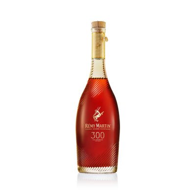 Remy Martin Coupe 300th Anniversary Cognac bottle with gold accents, 700mL, celebrating 300 years of Remy Martin craftsmanship.