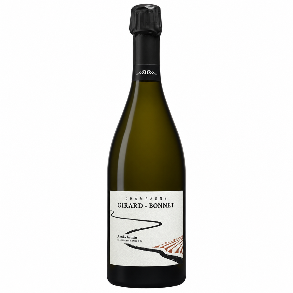 Elegant Champagne Girard Bonnet A Mi Chemin Blanc de Blancs Grand Cru Extra Brut in a flute glass.