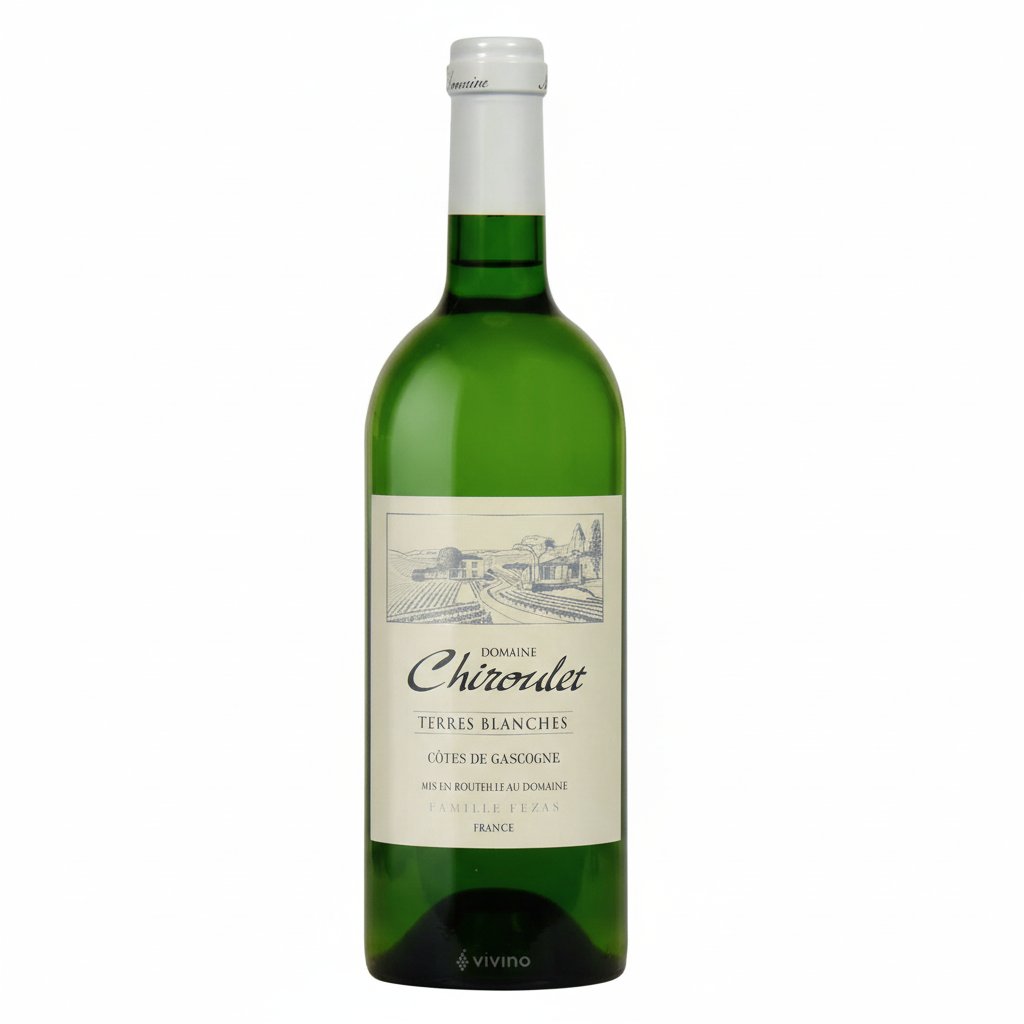 Chiroulet Terres Blanches wine bottle with label featuring white and gold design, standing upright on a wooden surface.