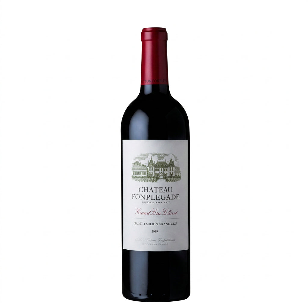 Bottle of Chateau Fonplegade red wine from Chateau, showing the label on a dark glass bottle with a cork and wine glass nearby.
