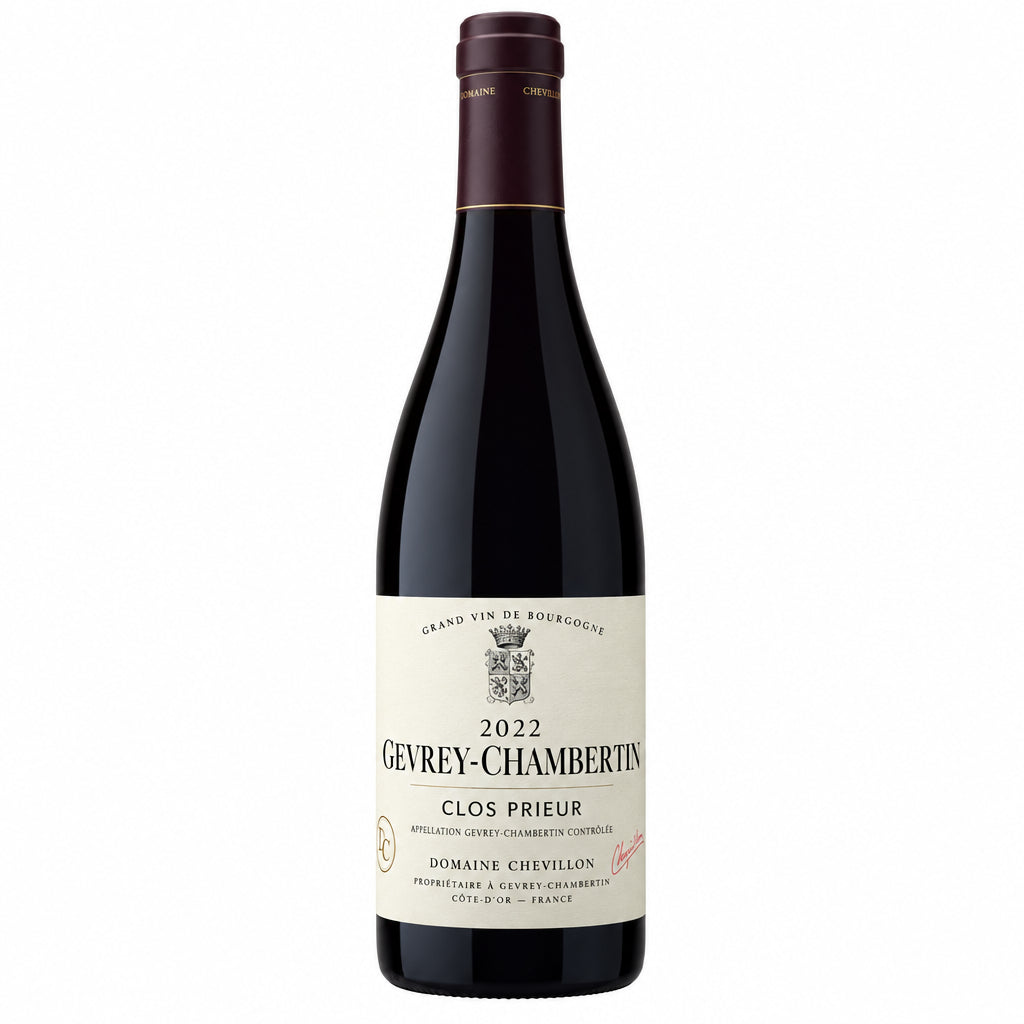 Domaine Marc Roy Gevrey-Chambertin Clos Prieur red wine bottle with label and cork in focus on a neutral background.