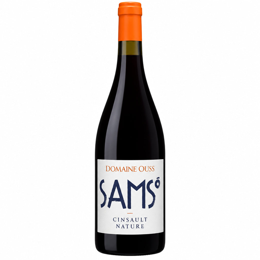 Domaine Maison Cazes Samso wine bottle with label featuring elegant design and natural cork, placed on a wooden surface.