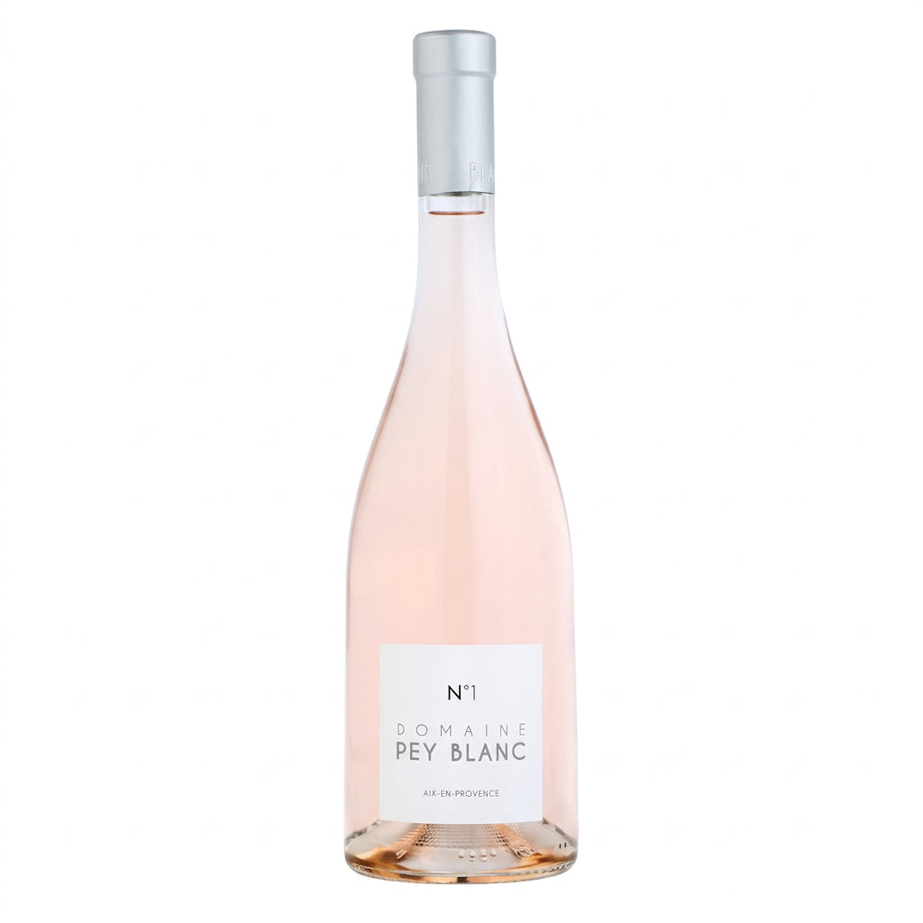 Domaine Pey Blanc N1 Rosé wine bottle with label and glass of rosé wine on a white background