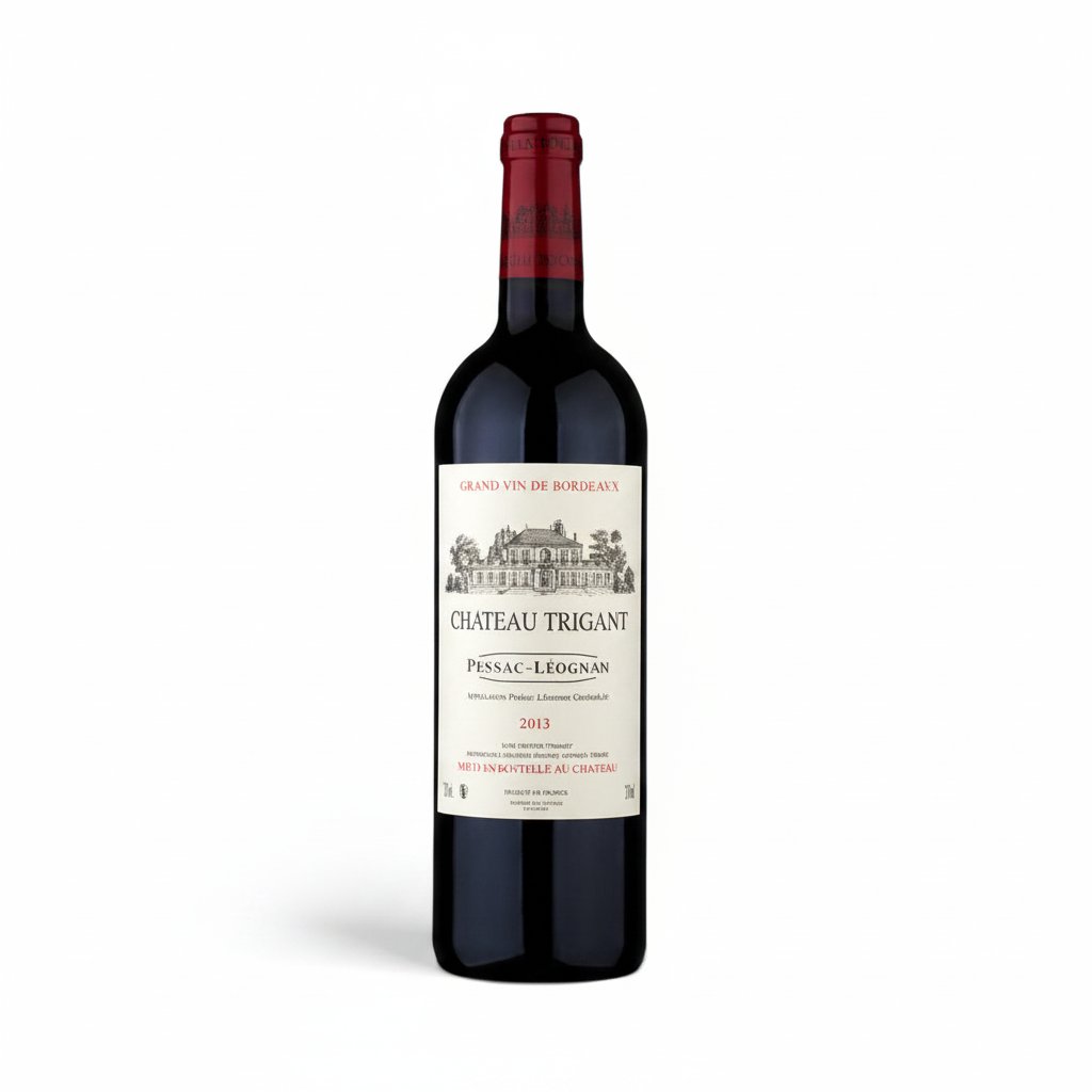 Chateau Trigant Pessac-Leognan wine bottle with label details, placed on a wooden surface.