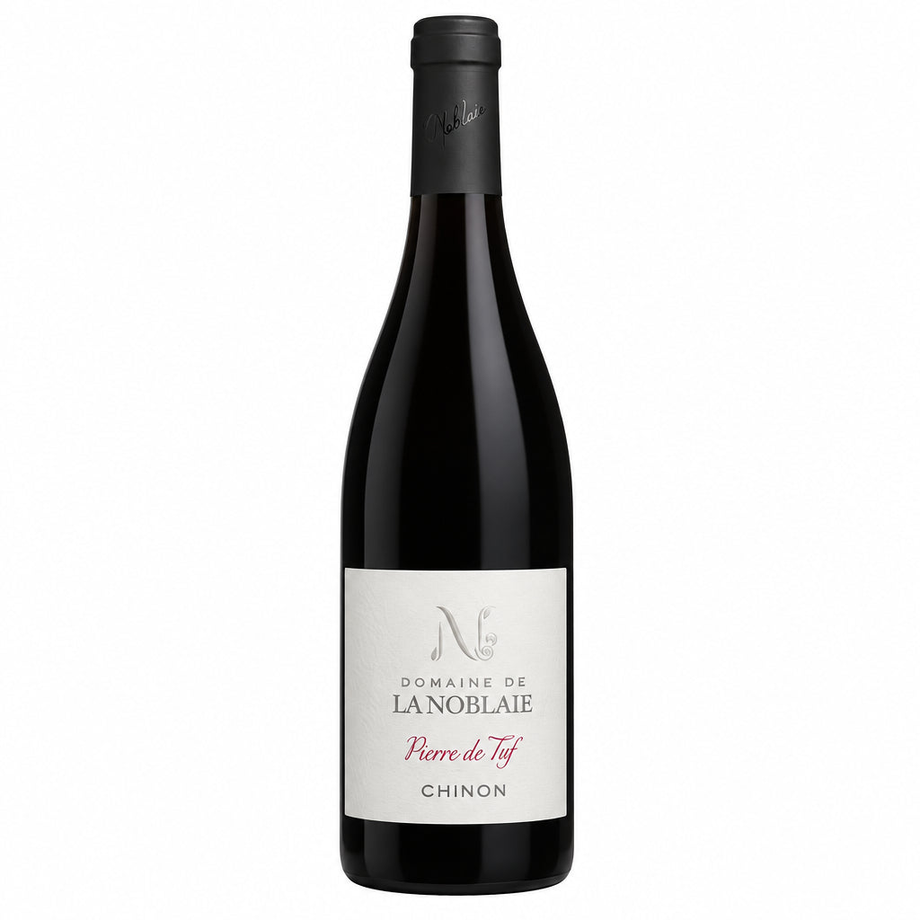 La Noblaie Chinon Pierre De Tuf wine bottle displayed on a table with a rustic background, showcasing the label and bottle shape.