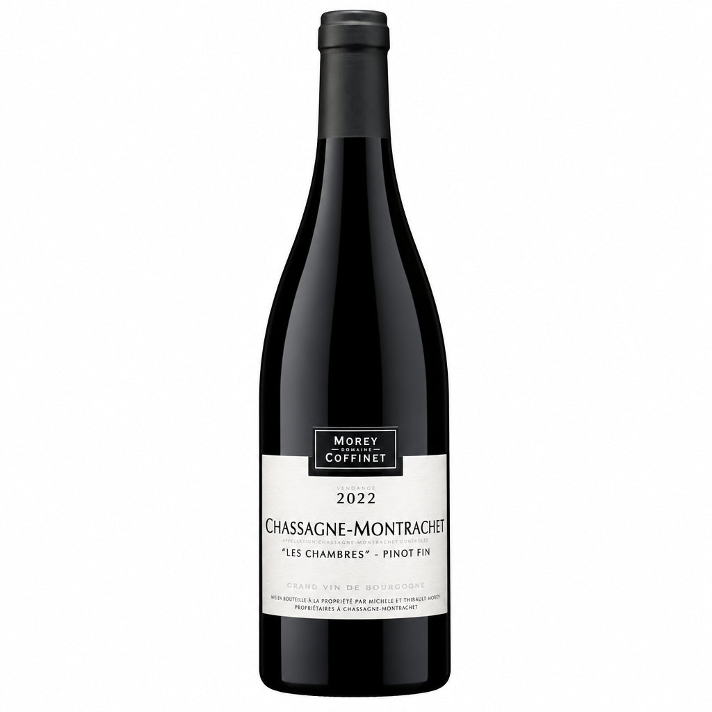 Domaine Morey-Coffinet Chassagne-Montrachet Les Chambres Pinot Fin wine bottle on a wooden surface.